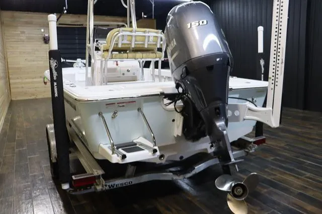 Slide: The Image of 2021 Sportsman Masters 207 Bay Boat with Yamaha 150 engine on trailer. - 3