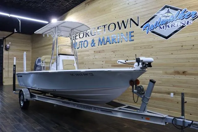 Slide: The Image of 2021 Sportsman Masters 207 Bay Boat displayed indoors at Georgetown Auto & Marine. - 4