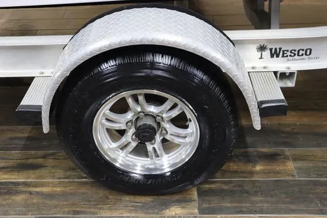 Slide: The Image of Trailer wheel of 2021 Sportsman Masters 207 Bay Boat, featuring Wesco Silverline Series. - 5