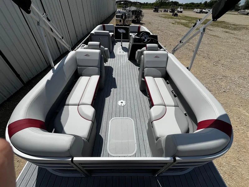 Slide: The Image of 2025 SunCatcher Select 324RC pontoon boat with spacious seating and modern design. - 11