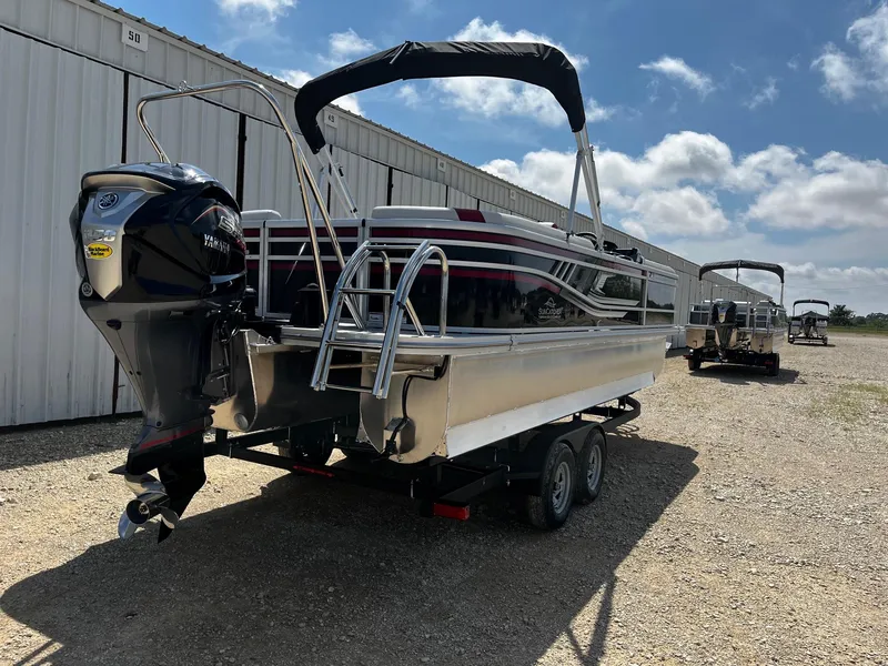 Slide: The Image of 2025 SunCatcher Select 324RC pontoon boat on trailer, parked outdoors. - 7