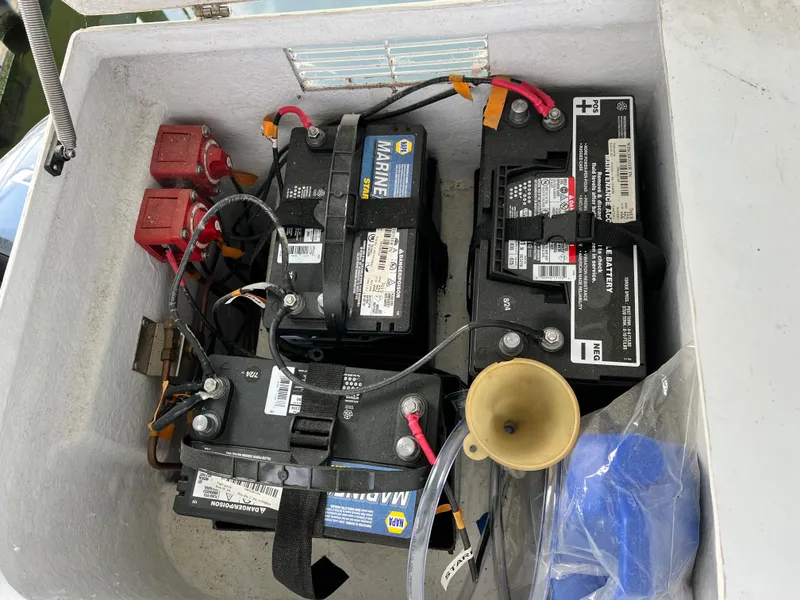 Slide: The Image of Marine batteries in a 2021 Catamaran Cruisers 39 x 12 houseboat compartment. - 17