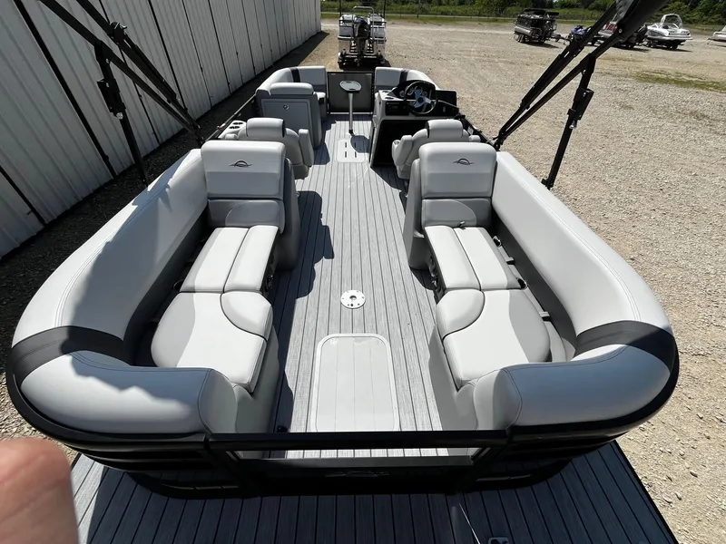 Slide: The Image of 2025 SunCatcher Select 322RC pontoon boat with spacious seating and modern design. - 11