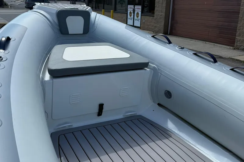 Slide: The Image of 2025 Highfield CL400 inflatable boat interior with seating and storage. - 9
