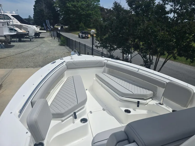 Slide: The Image of 2025 Pursuit S 248 Sport boat with spacious seating and sleek design. - 9