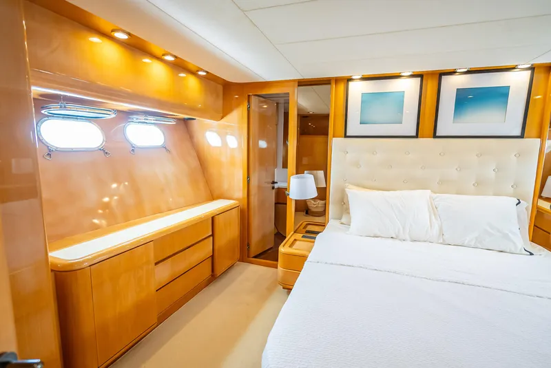 Slide: The Image of Luxurious bedroom interior of 1995 Sanlorenzo 62 yacht with elegant wood finishes and modern decor. - 20