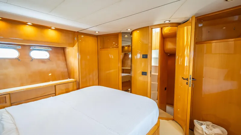 Slide: The Image of Luxurious cabin interior of a 1995 Sanlorenzo 62 yacht with wooden finishes. - 21
