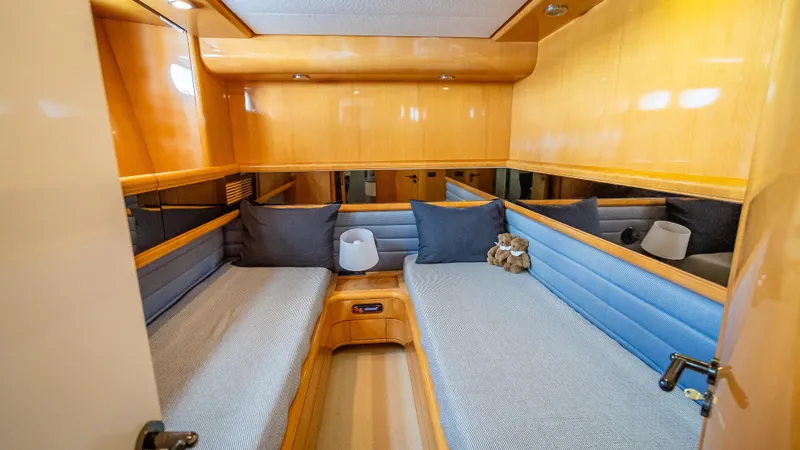 Slide: The Image of Luxurious cabin interior of 1995 Sanlorenzo 62 yacht with twin beds and wooden finish. - 29