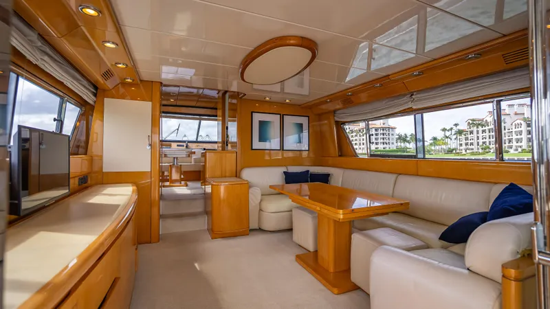 Slide: The Image of Luxurious interior of a 1995 Sanlorenzo 62 yacht with elegant wood finishes and plush seating. - 38