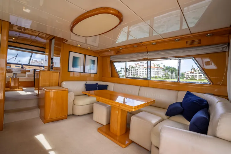 Slide: The Image of Luxurious interior of a 1995 Sanlorenzo 62 yacht with elegant seating and wood finishes. - 39