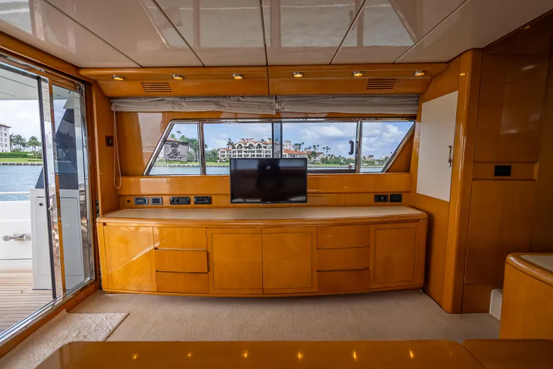 Slide: The Image of Luxurious interior of 1995 Sanlorenzo 62 yacht with wood cabinetry and large windows. - 45