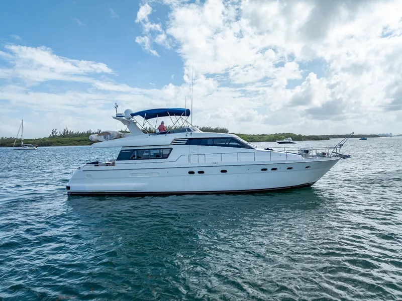 Slide: The Image of Sanlorenzo 62 yacht from 1995 cruising on a sunny day with blue skies. - 8