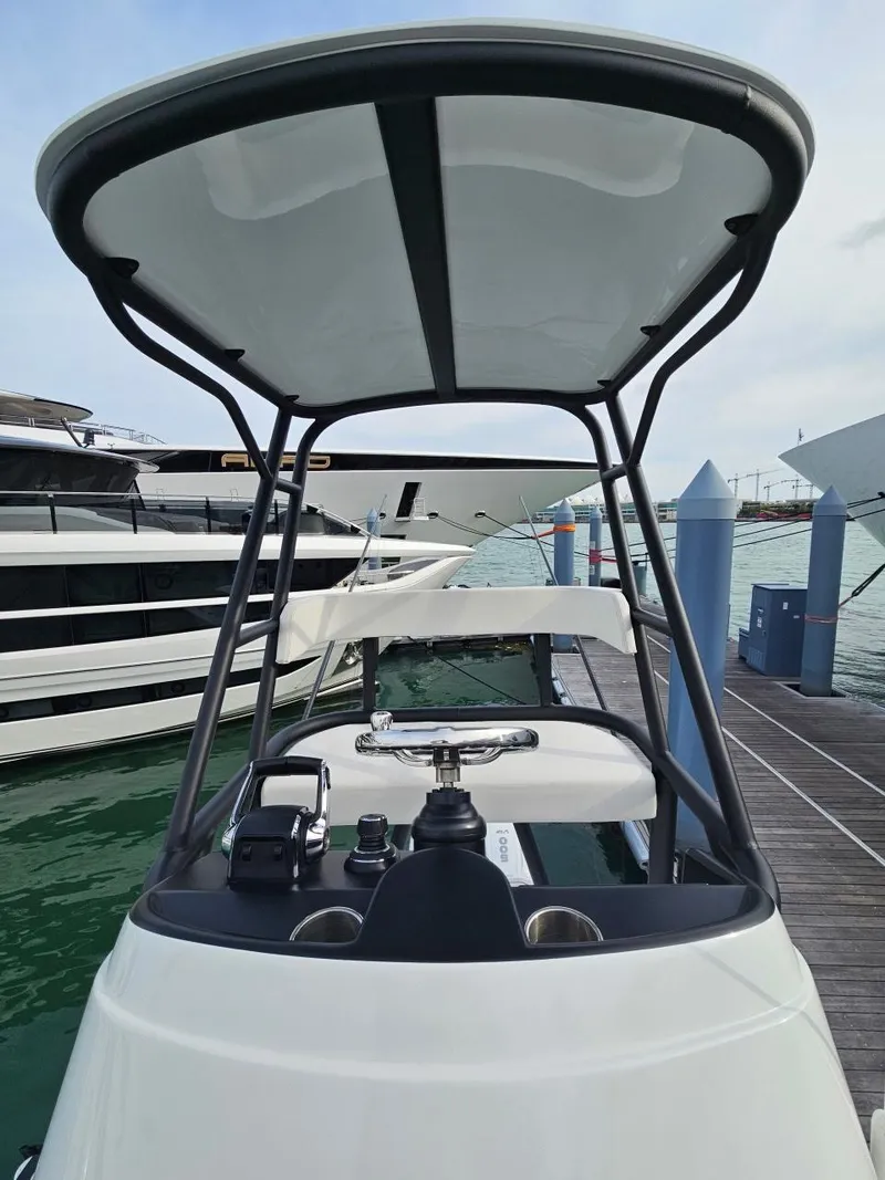 Slide: The Image of 2022 Yellowfin 39 Offshore boat docked at marina, featuring sleek design and modern controls. - 13