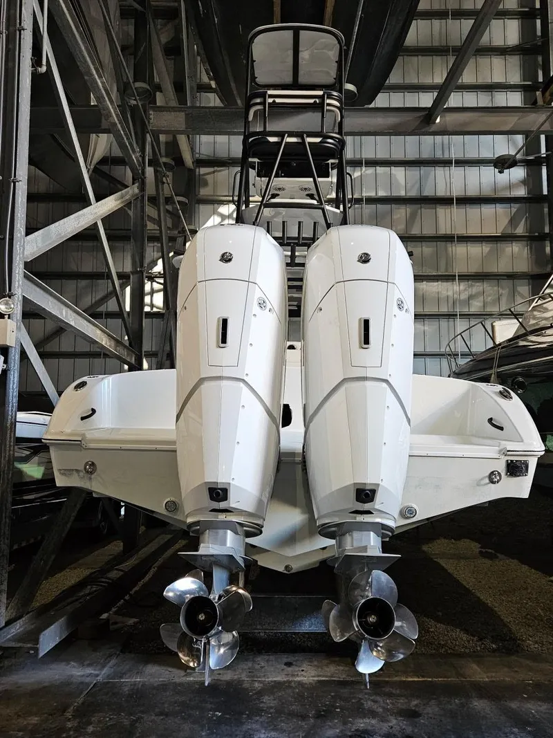 Slide: The Image of 2022 Yellowfin 39 Offshore boat with dual outboard engines in storage facility. - 14