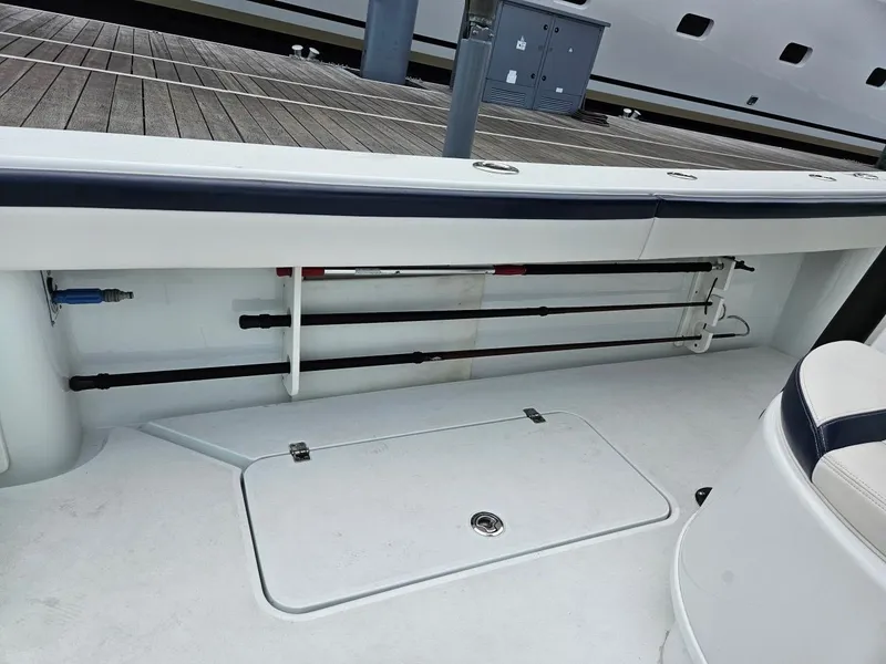 Slide: The Image of 2022 Yellowfin 39 Offshore boat with rod storage and seating area. - 16