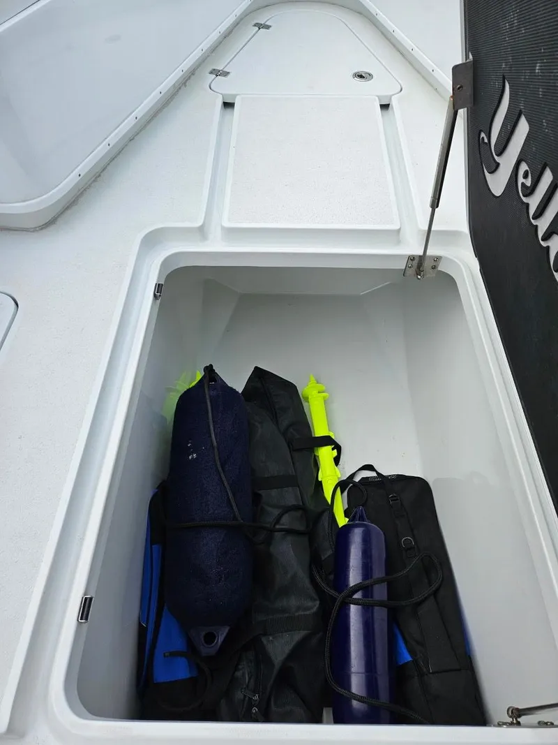 Slide: The Image of Storage compartment on 2022 Yellowfin 39 Offshore boat with marine equipment. - 18