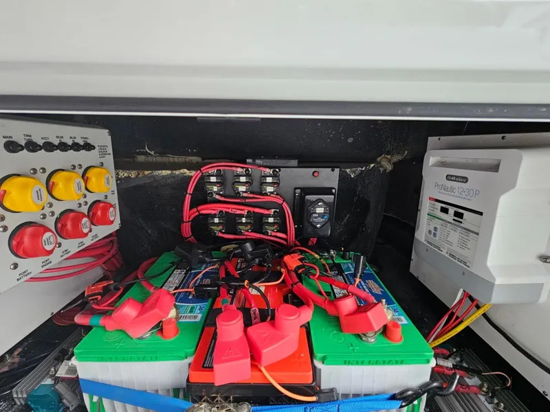 Slide: The Image of Electrical system of a 2022 Yellowfin 39 Offshore boat, featuring batteries and wiring. - 21