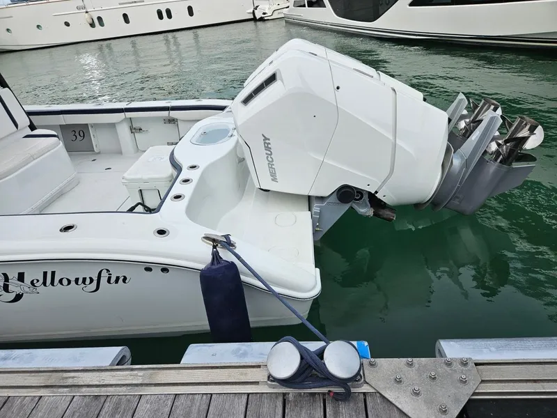 Slide: The Image of 2022 Yellowfin 39 Offshore boat with Mercury outboard engine docked at marina. - 22