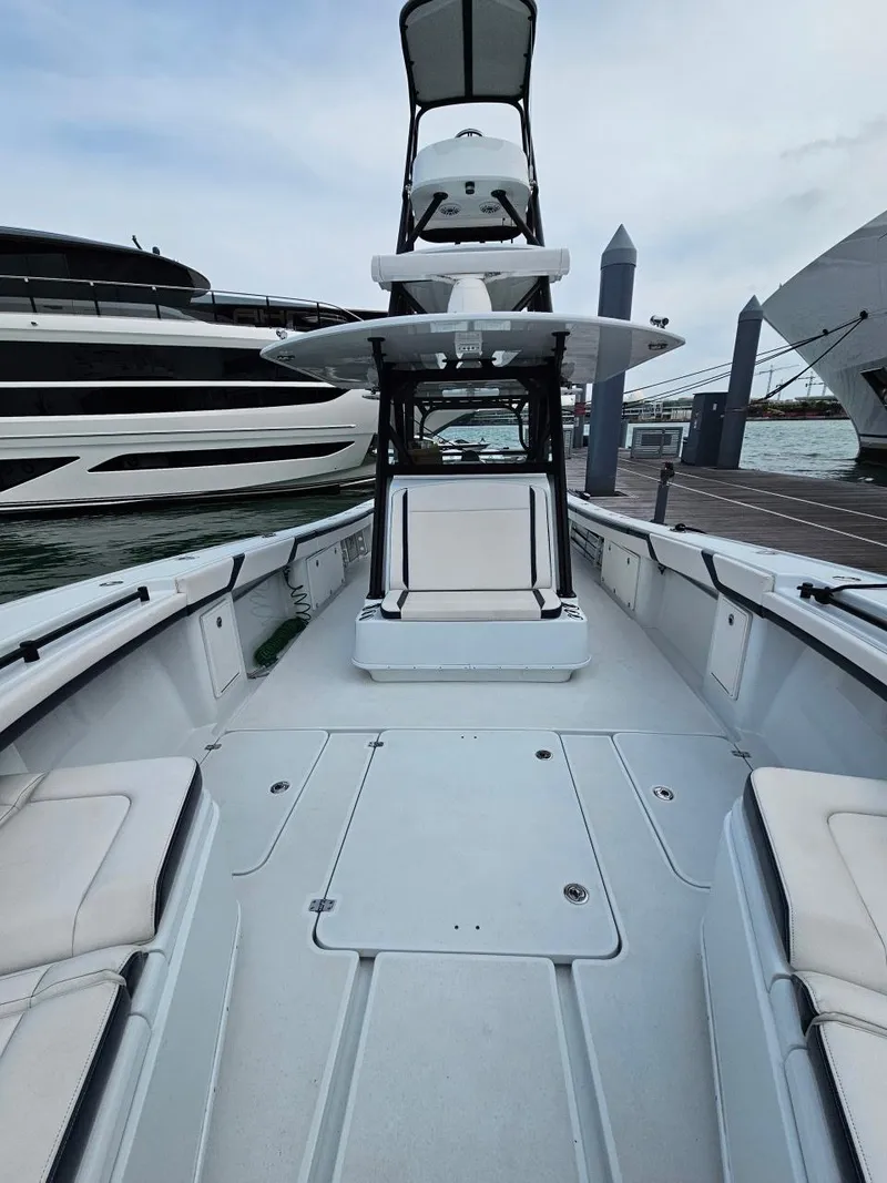 Slide: The Image of 2022 Yellowfin 39 Offshore boat docked, featuring spacious deck and modern design. - 5