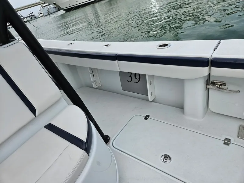 Slide: The Image of 2022 Yellowfin 39 Offshore boat interior with seating and water view. - 7