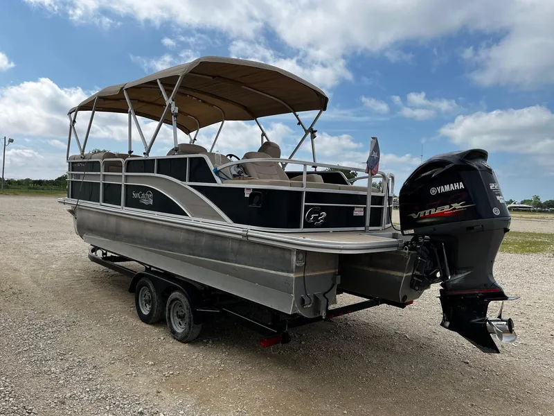 Slide: The Image of 2016 SunCatcher Elite 324 RS pontoon boat with Yamaha engine on trailer. - 5