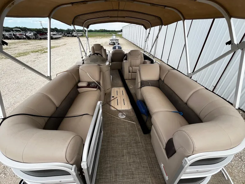 Slide: The Image of 2016 SunCatcher Elite 324 RS pontoon boat with beige seating and canopy. - 8