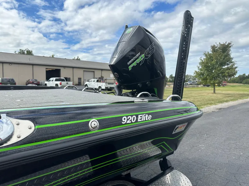 Slide: The Image of 2021 Phoenix 920 Elite boat with Mercury Pro XS engine, parked outdoors. - 11