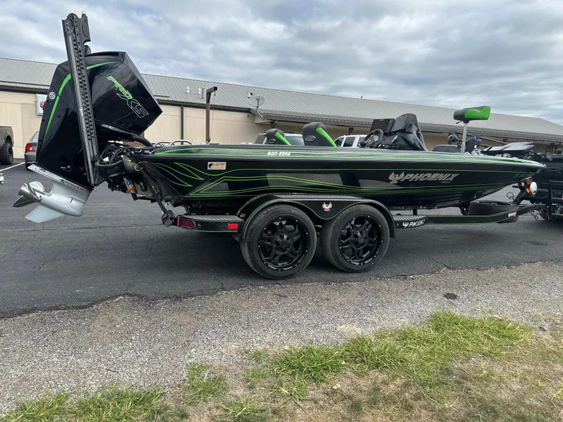 Slide: The Image of 2021 Phoenix 920 Elite boat with dual-axle trailer, parked outdoors. - 7