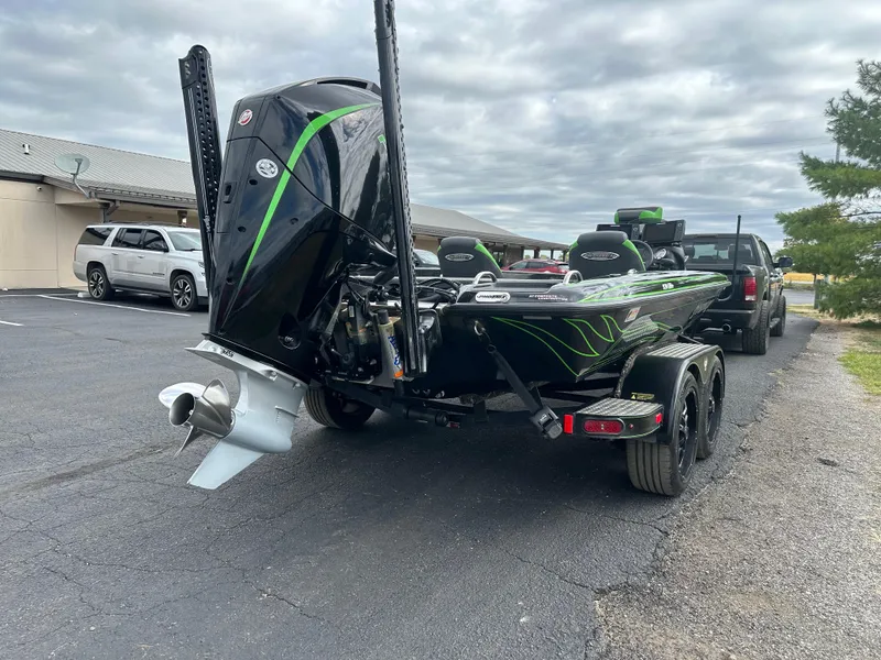 Slide: The Image of 2021 Phoenix 920 Elite boat on trailer, parked in a lot under cloudy skies. - 8