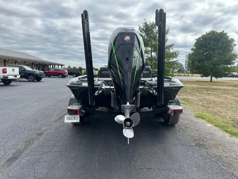 Slide: The Image of Rear view of a 2021 Phoenix 920 Elite boat with motor and dual power poles. - 9