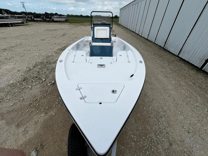 Slide: The Image of 2025 Blazer Bay 2220 Fisherman boat on gravel near storage facility. - 7