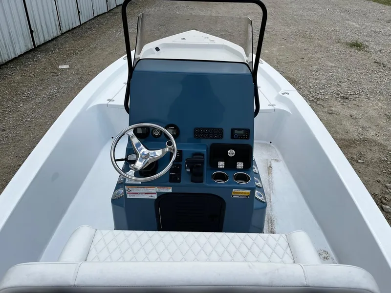 Slide: The Image of 2025 Blazer Bay 2220 Fisherman boat interior with steering console and seating. - 8