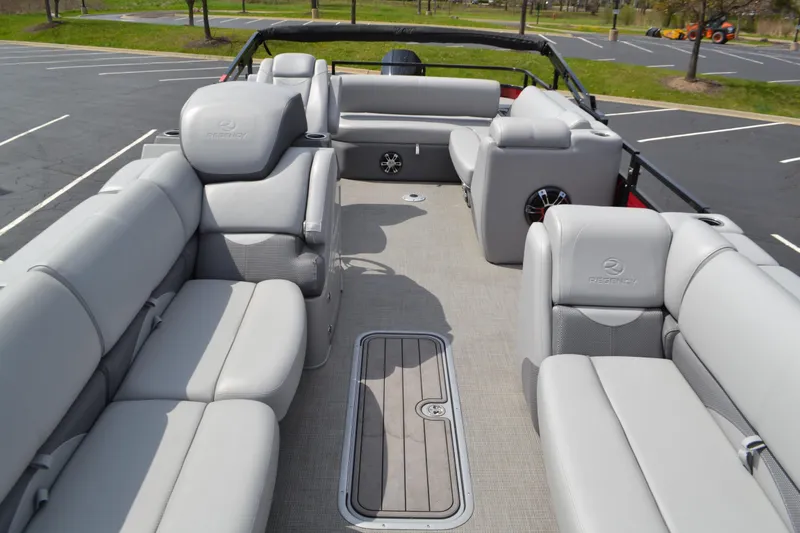 Slide: The Image of 2022 Regency 250DL3 pontoon boat interior with luxurious gray seating and spacious layout. - 4
