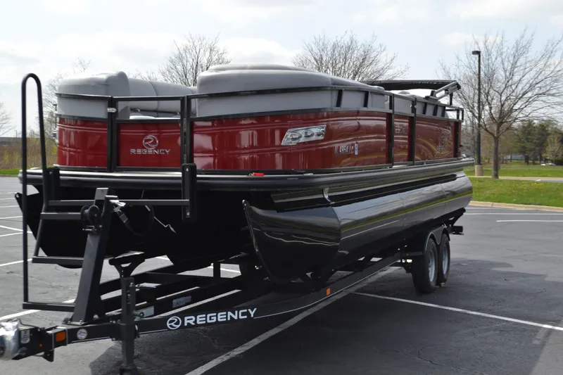 Slide: The Image of 2022 Regency 250DL3 pontoon boat on trailer in parking lot. - 7