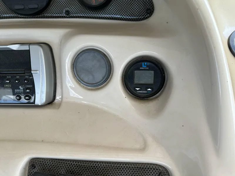 Slide: The Image of Dashboard of 2004 PlayCraft 2500 Ultra boat with stereo and gauge. - 18