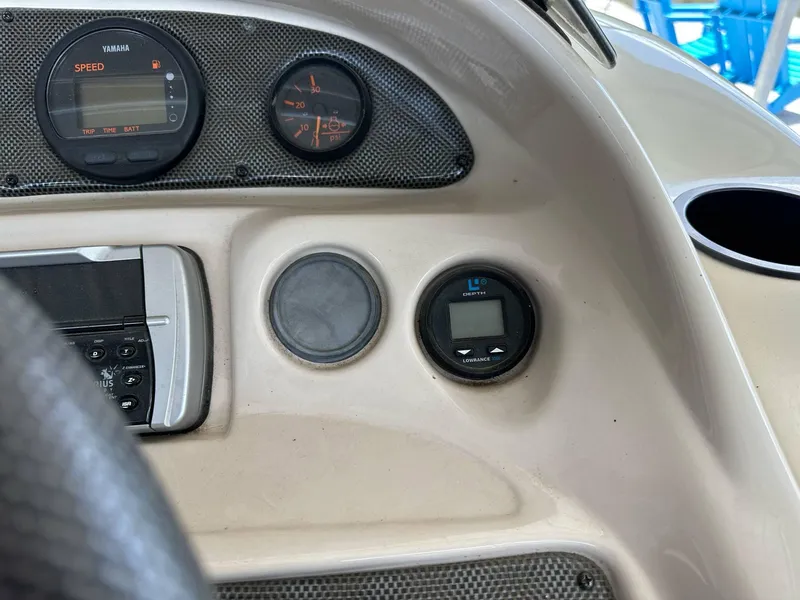 Slide: The Image of Dashboard of a 2004 PlayCraft 2500 Ultra boat with gauges and controls. - 9