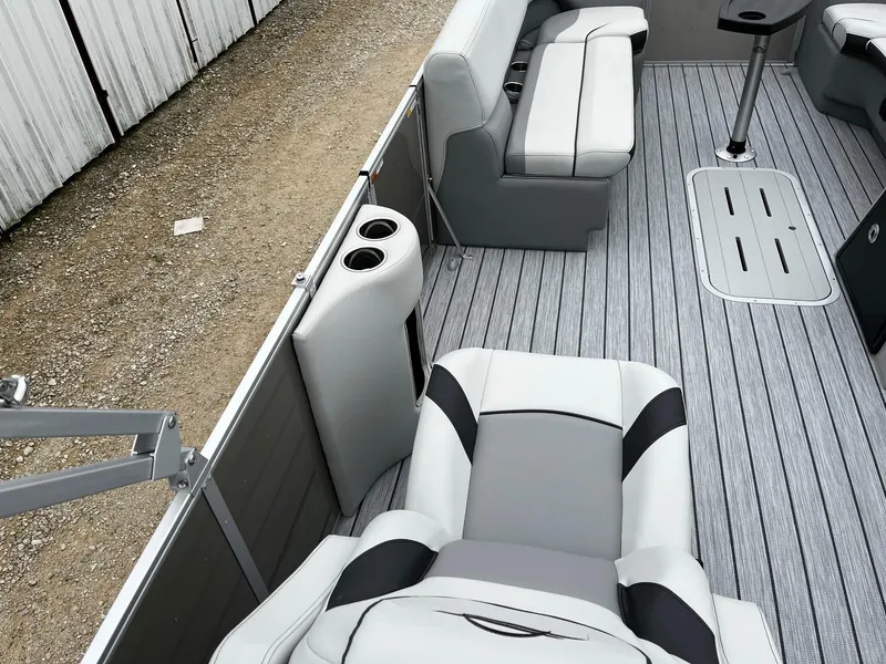 Slide: The Image of 2025 SunCatcher Select 324SL boat interior with gray seating and flooring. - 10