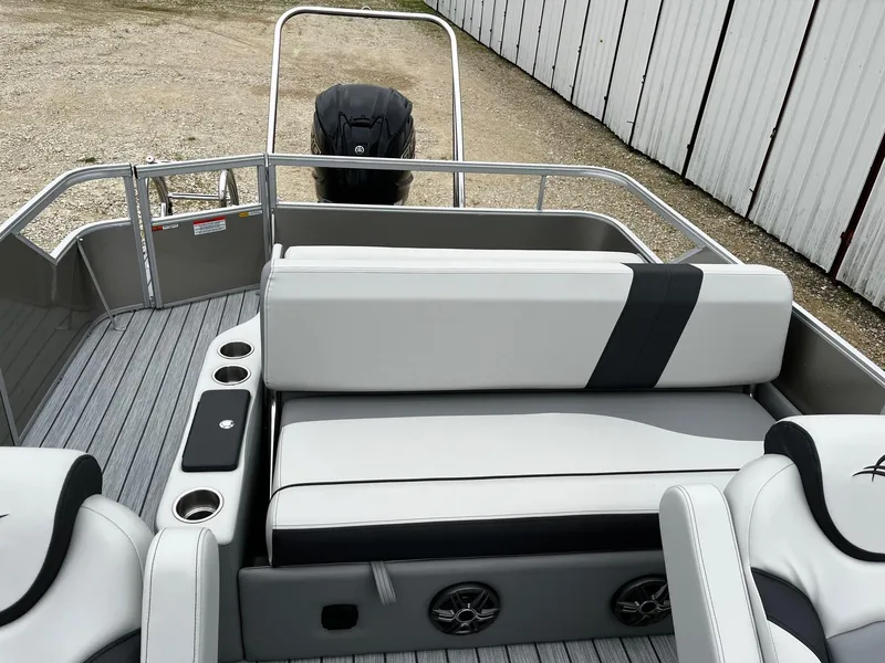 Slide: The Image of 2025 SunCatcher Select 324SL pontoon boat interior with seating and cup holders. - 11
