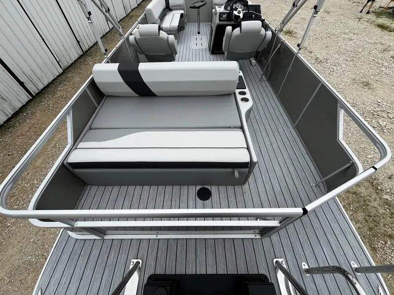 Slide: The Image of 2025 SunCatcher Select 324SL pontoon boat with spacious seating and modern design. - 12
