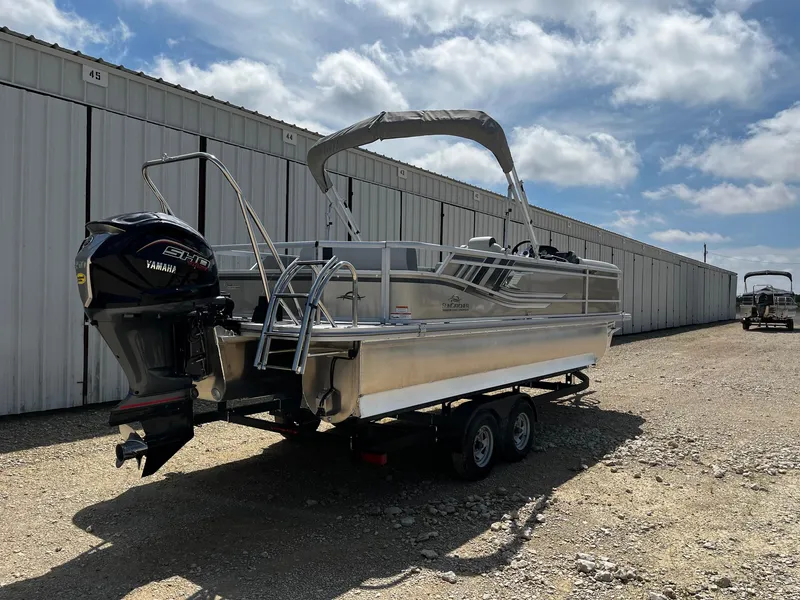 Slide: The Image of 2025 SunCatcher Select 324SL pontoon boat with Yamaha motor on a trailer. - 7