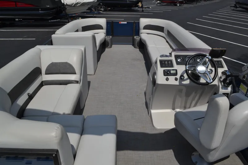 Slide: The Image of 2019 Crest 220 SF pontoon boat interior with spacious seating and modern helm. - 3