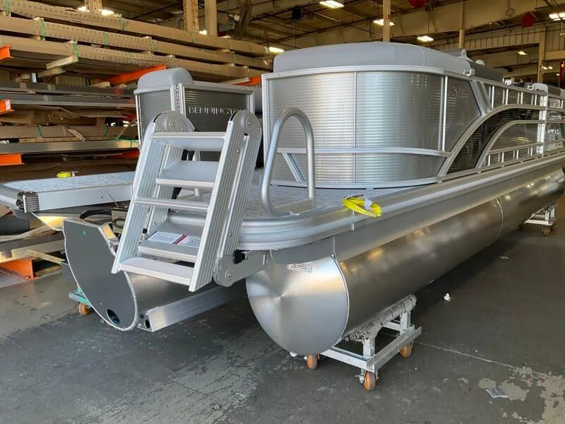 Slide: The Image of 2025 Bennington 23SSR-SPS pontoon boat in a warehouse setting. - 4