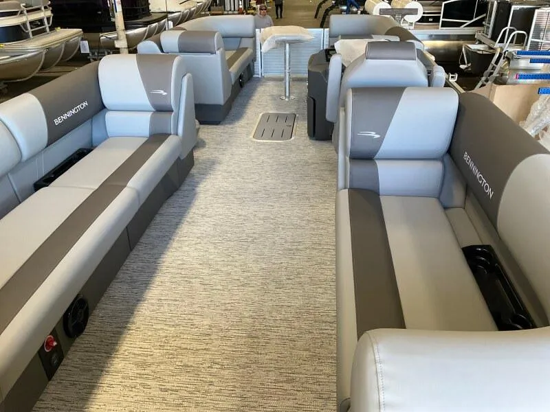 Slide: The Image of 2025 Bennington 23SSR-SPS pontoon boat interior with gray seating and spacious layout. - 6