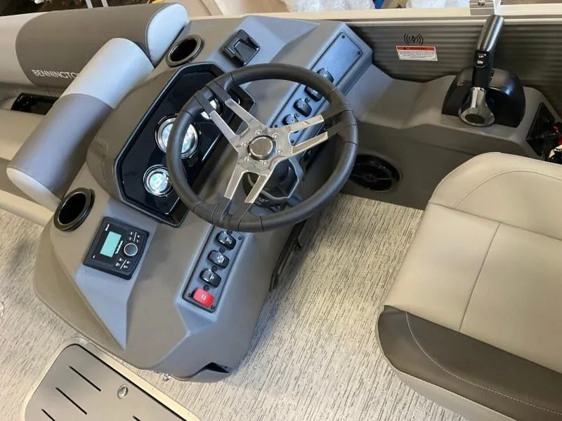 Slide: The Image of 2025 Bennington 23SSR-SPS boat dashboard with steering wheel and controls. - 7