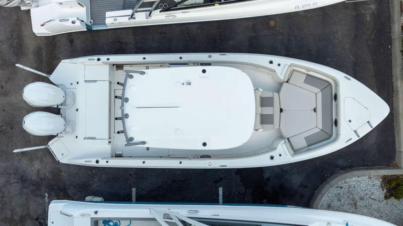 Slide: The Image of Top view of a 2025 Solace 28 HCS boat with dual engines. - 1