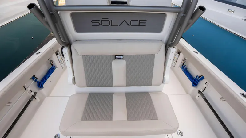 Slide: The Image of 2025 Solace 28 HCS boat seating with gray and white upholstery. - 18