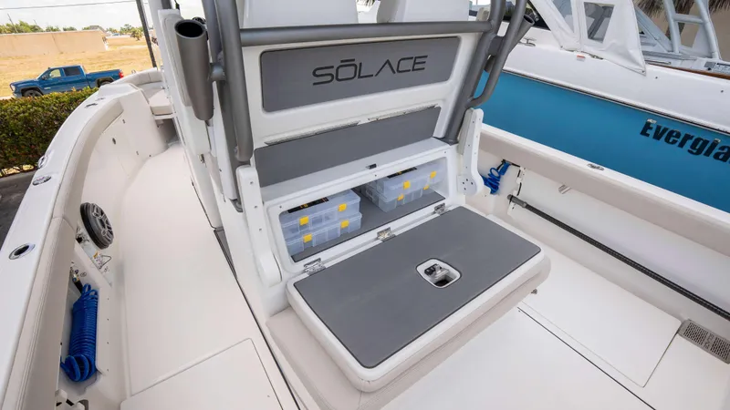 Slide: The Image of 2025 Solace 28 HCS boat interior with storage compartments and seating. - 20