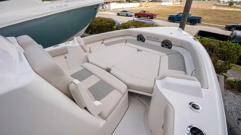Slide: The Image of Luxurious seating area on 2025 Solace 28 HCS boat, featuring plush cushions and sleek design. - 27