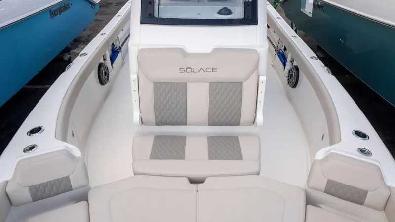 Slide: The Image of 2025 Solace 28 HCS boat interior with beige seating and modern design. - 5