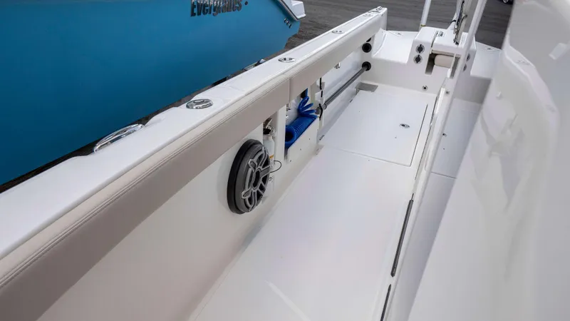 Slide: The Image of 2025 Solace 28 HCS boat interior with storage and speaker system. - 6